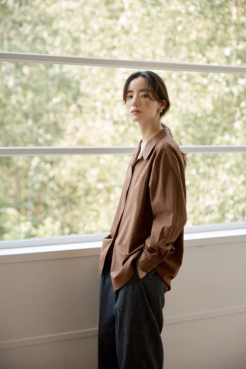 Side angle view of brown Flex-Weave cotton shirt showing relaxed fit, chest pocket detail, and soft breathable fabric