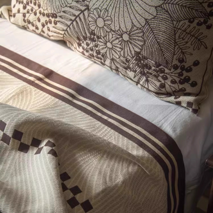 Close-up of Floral Cotton Gauze Blanket Elegant Splendor showing striped border and soft cotton gauze texture
