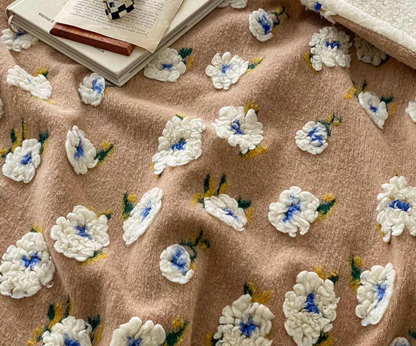 Close-up of Coffee Daisy fleece blanket highlighting plush floral texture