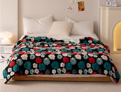 Jacquard Green floral fleece throw blanket styled across bed with pillows