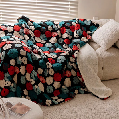 Jacquard Green floral fleece throw blanket draped over sofa in cozy living room setting