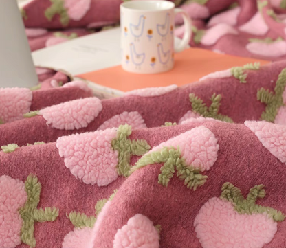 Close-up of Peach fleece blanket highlighting plush jacquard floral texture