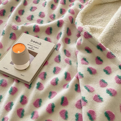 Close-up of Strawberry fleece blanket showing soft plush fruit pattern texture