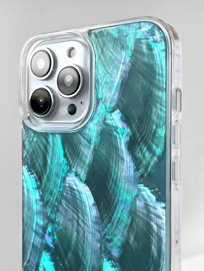 Close-up of blue mother-of-pearl shell phone case showing raised camera protection and glossy shell texture
