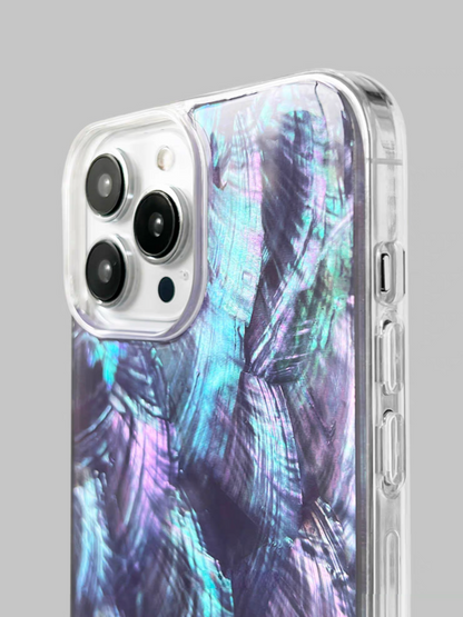 Close-up of purple mother-of-pearl shell phone case highlighting iridescent texture and protective camera surround