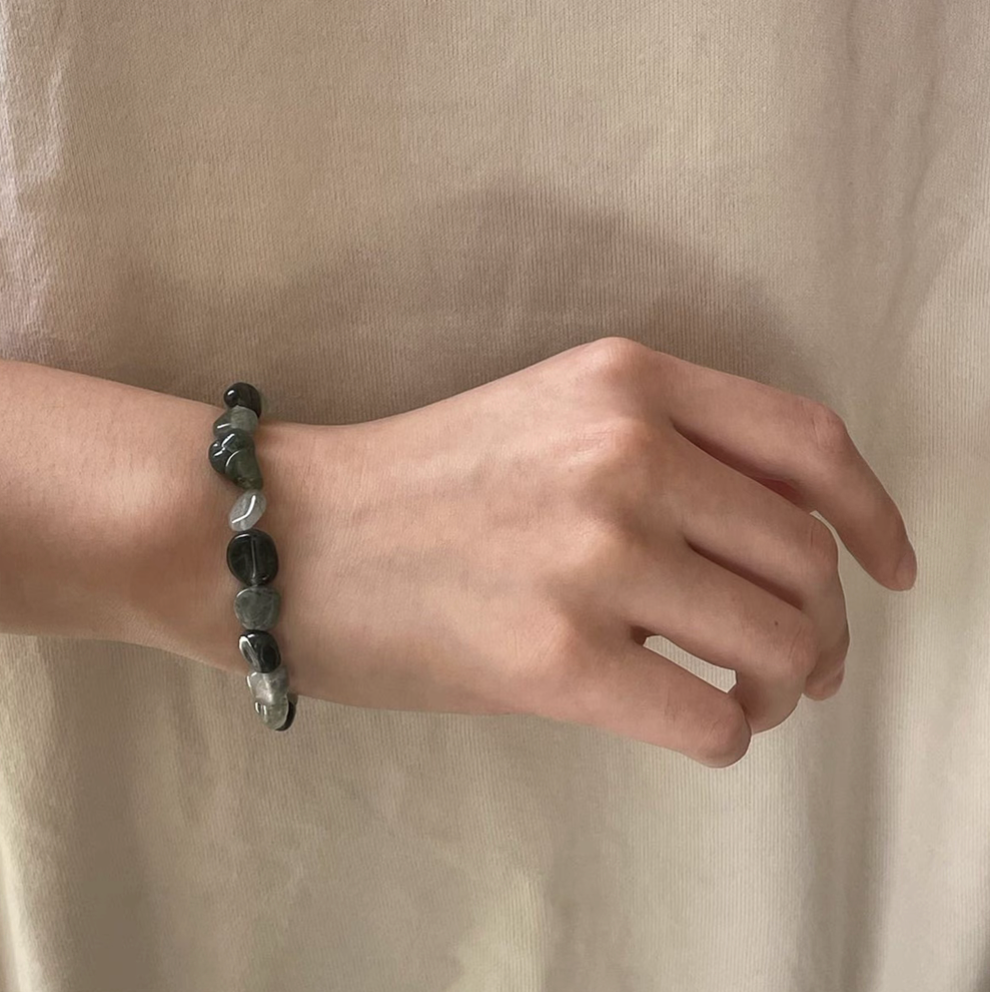 forest spirit gemstone bracelet in green rutilated quartz worn on wrist