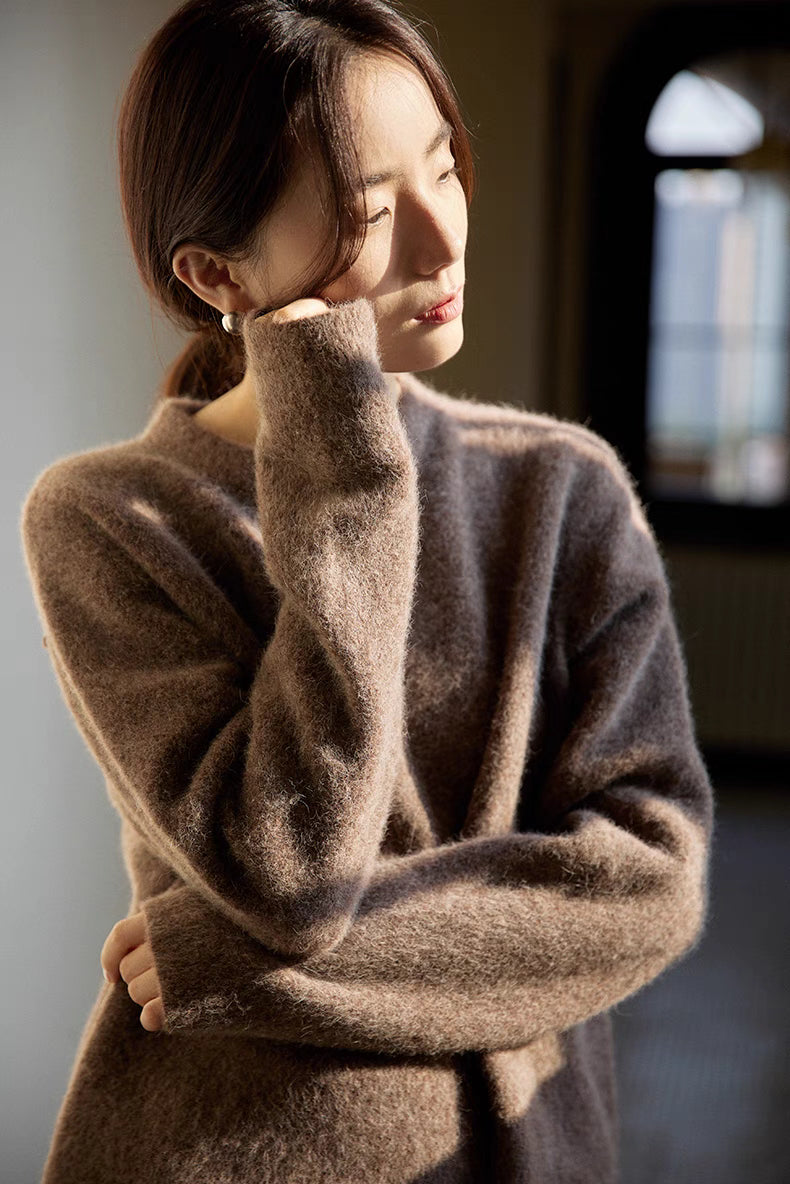 Coffee brown brushed wool crewneck sweater worn in warm light emphasizing plush texture and cozy feel