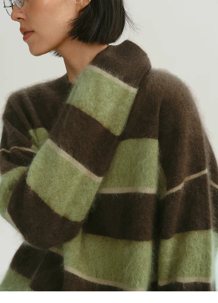 close-up of brown green fuzzy stripe alpaca sweater texture and shoulder