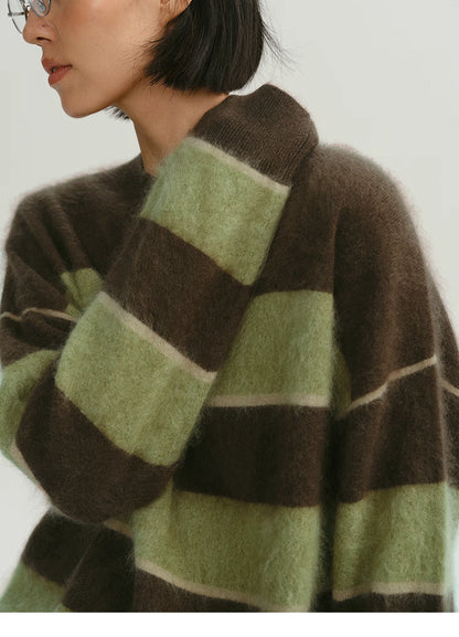 close-up of brown green fuzzy stripe alpaca sweater texture and shoulder