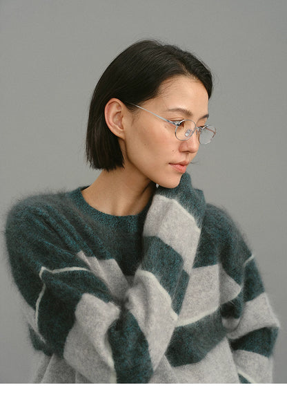 close-up of dark green gray fuzzy alpaca sweater neckline and texture