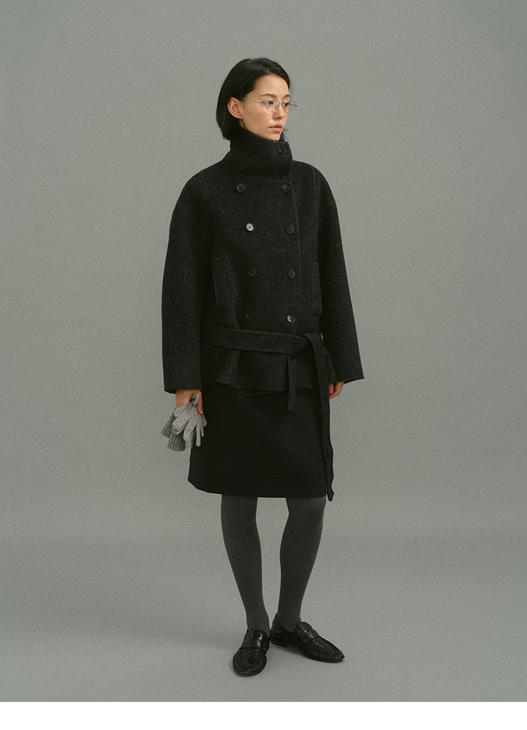 Charcoal wool and camel hair coat with funnel collar, double-breasted front and tied belt, full-length view