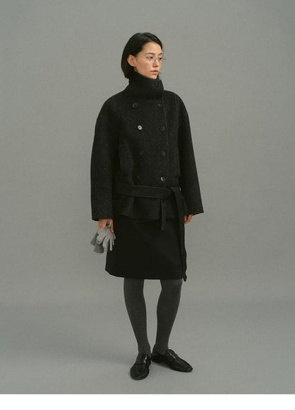 Charcoal wool and camel hair coat with funnel collar, double-breasted front and tied belt, full-length view