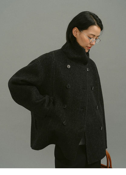 Close view of brushed charcoal double-face wool, buttons and side pocket