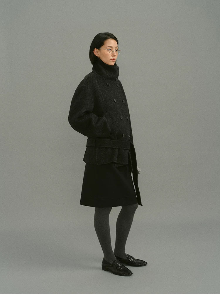Full side view of charcoal belted funnel-collar coat