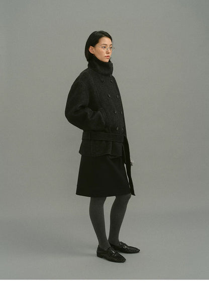 Full side view of charcoal belted funnel-collar coat