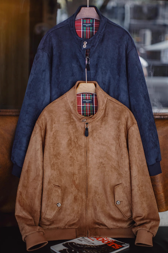 Navy and camel suede Harrington jackets side by side
