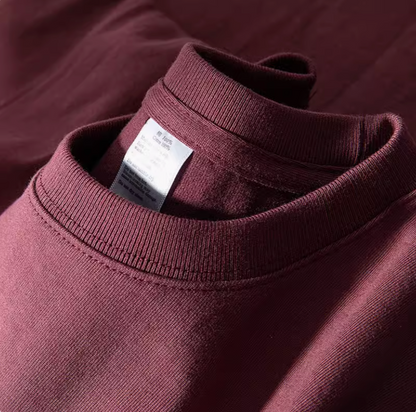 Grape Glow Tee Burgundy ribbed crewneck collar close-up with stitching detail