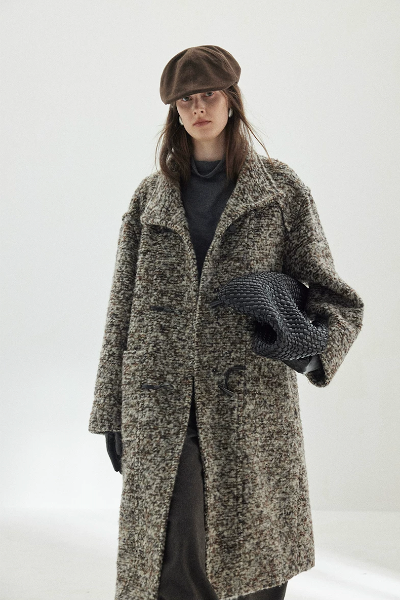 Gray Marl bouclé wool coat worn open, with the stand collar folded and faux-leather toggle loops