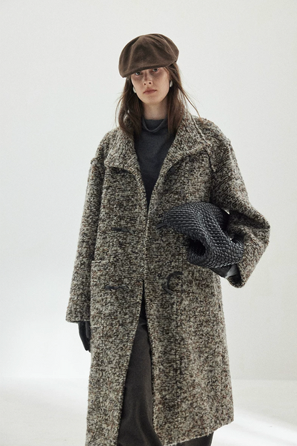 Gray Marl bouclé wool coat worn open, with the stand collar folded and faux-leather toggle loops