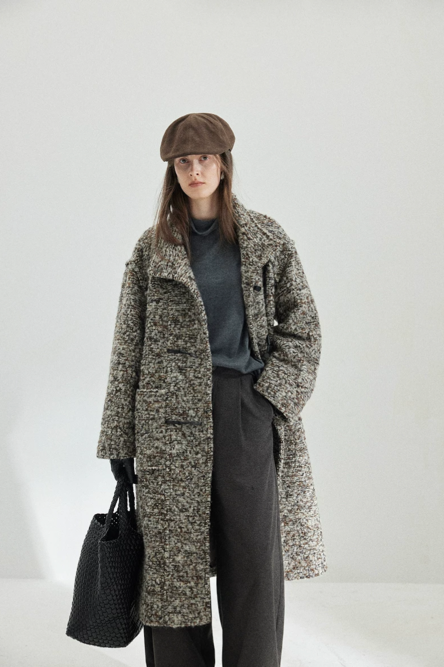 Gray Marl multicolor bouclé wool coat worn open, with the stand collar up and a front patch pocket