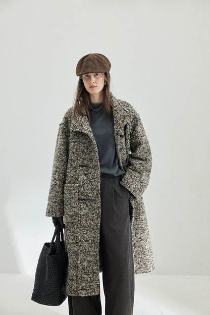 Gray Marl multicolor bouclé wool coat worn open, with the stand collar up and a front patch pocket