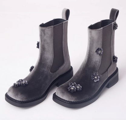 Pair of gray silk velvet Chelsea boots with black sequin flowers, front angle