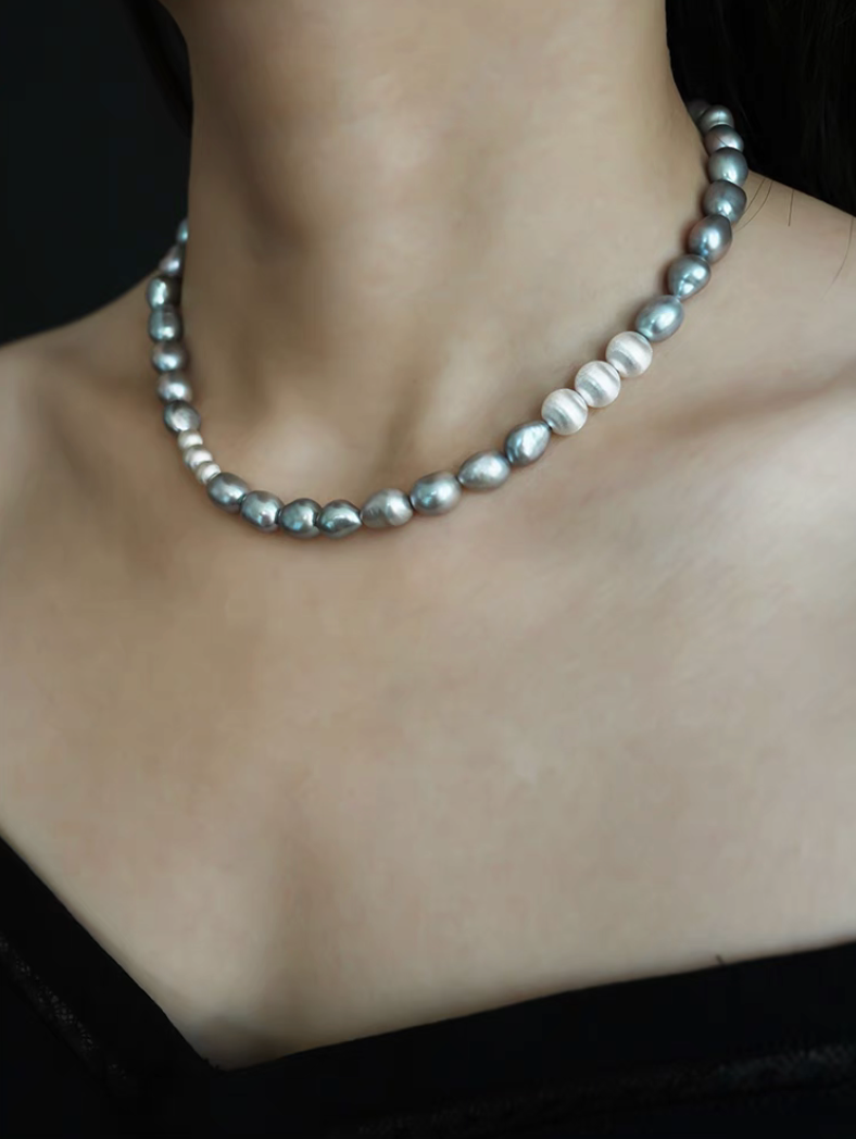 Grey Pearl Silver Necklace on model neck detail highlighting smooth grey pearl arrangement