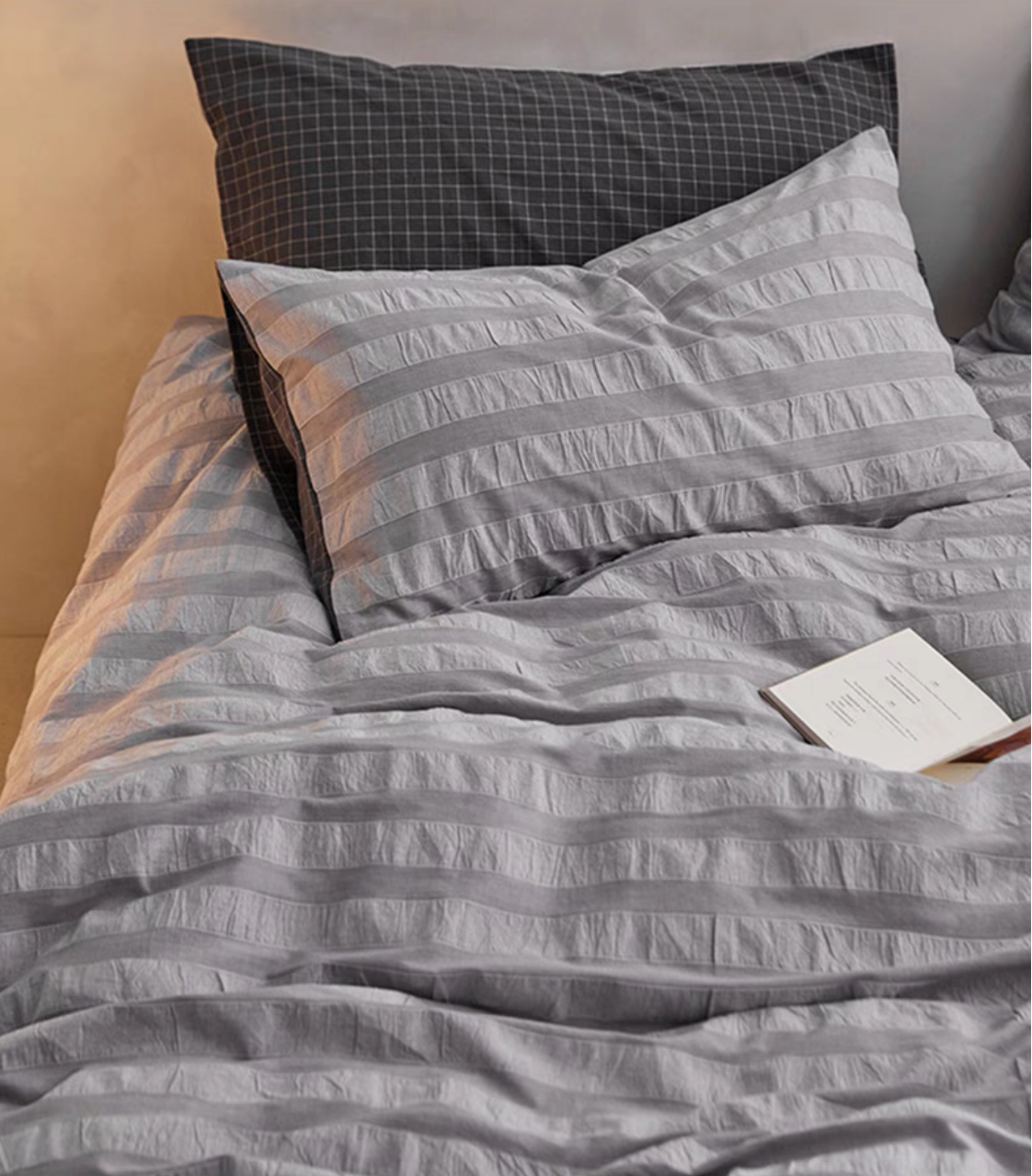 Gray Grid cotton bedding close-up with textured stripe duvet cover and checked pillow sham detail
