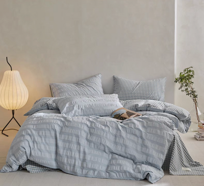 Light Blue Grid cotton duvet, sheet and shams set with textured stripe duvet cover and checked bedding in bedroom