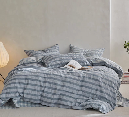 Slate Blue Grid cotton duvet, sheet and shams set with textured stripe duvet cover and checked bedding in bedroom
