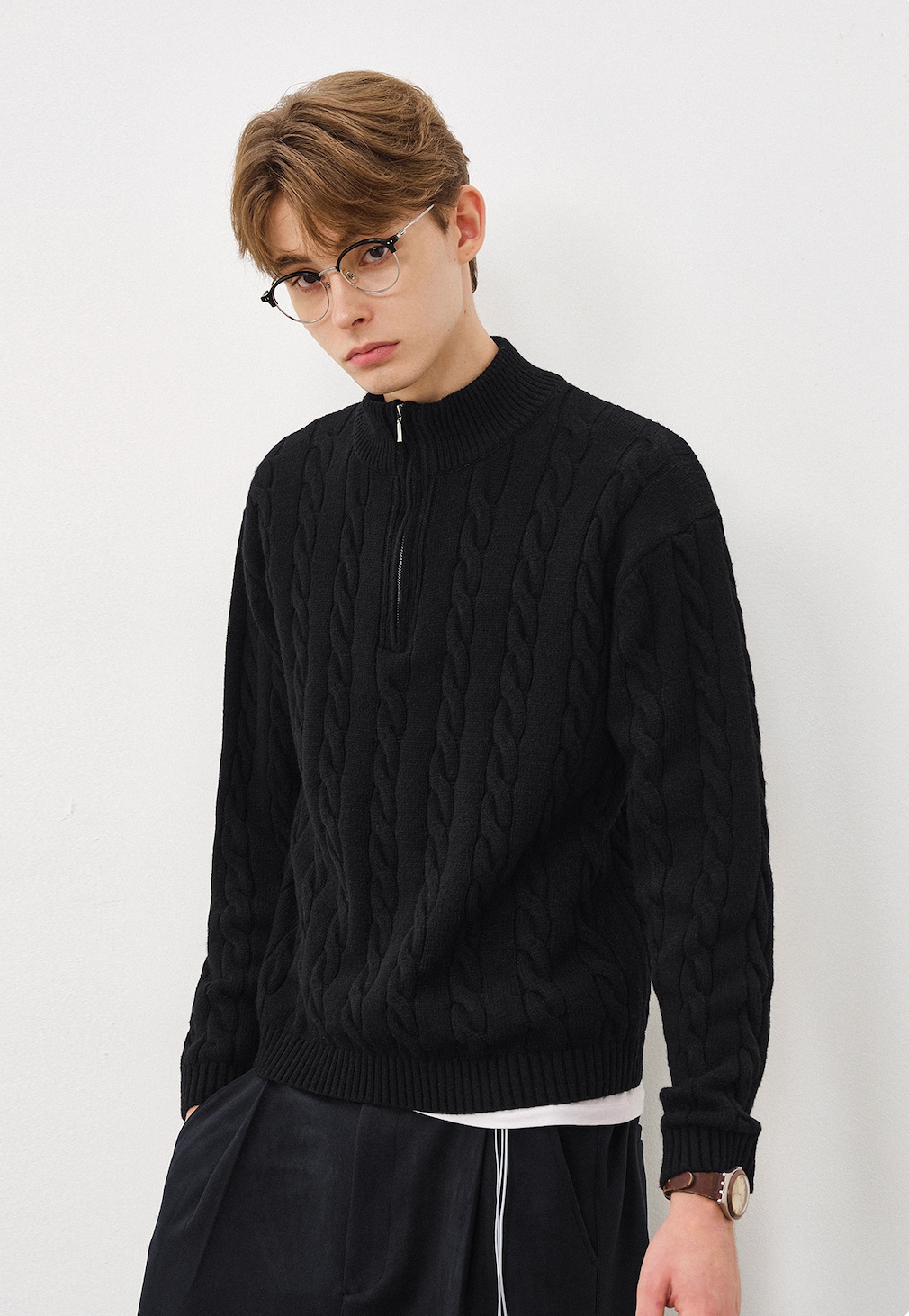 Men’s black mock neck half-zip cable knit sweater front view.