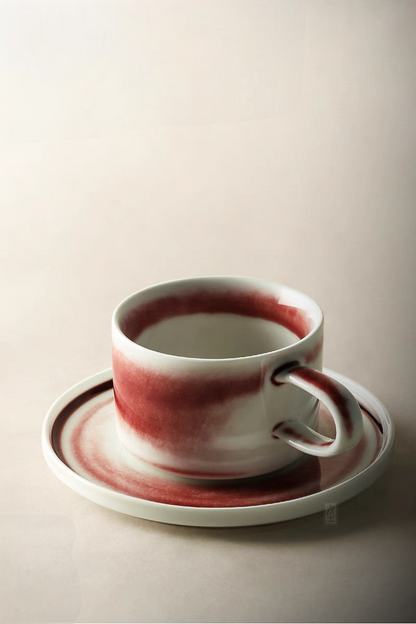 Style 1 ceramic coffee cup and saucer beige and red showing side handle design and smooth glazed surface