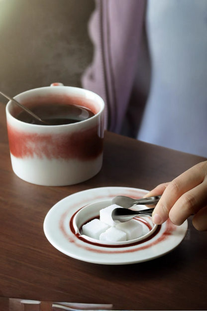 Style 2 ceramic saucer used for sugar cubes with matching crimson glaze showing functional tableware detail