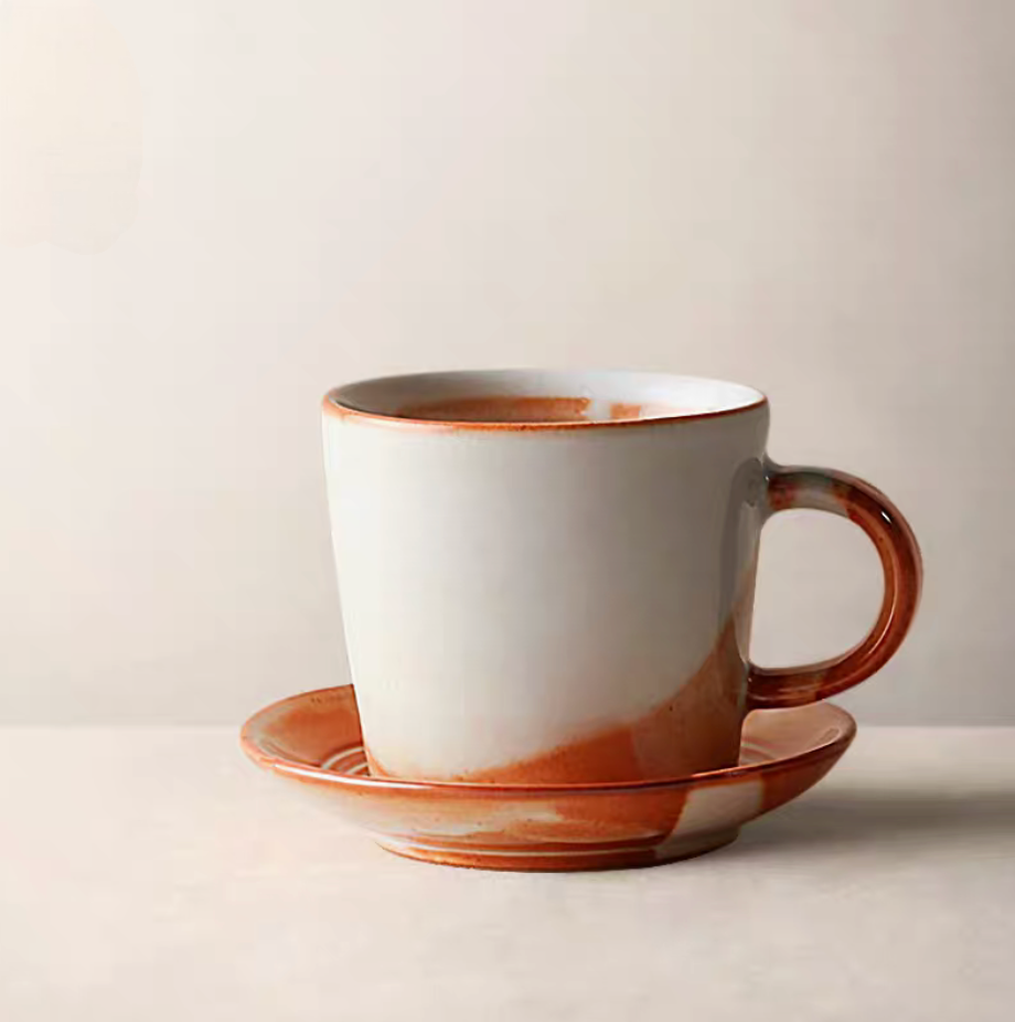 Style 3 handcrafted ceramic mug in off-white and orange single product view highlighting smooth curved shape and glaze