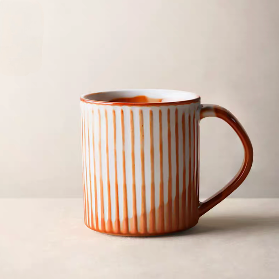 Style 4 handcrafted ceramic mug interior showing off-white and orange glaze pattern and smooth finish detail