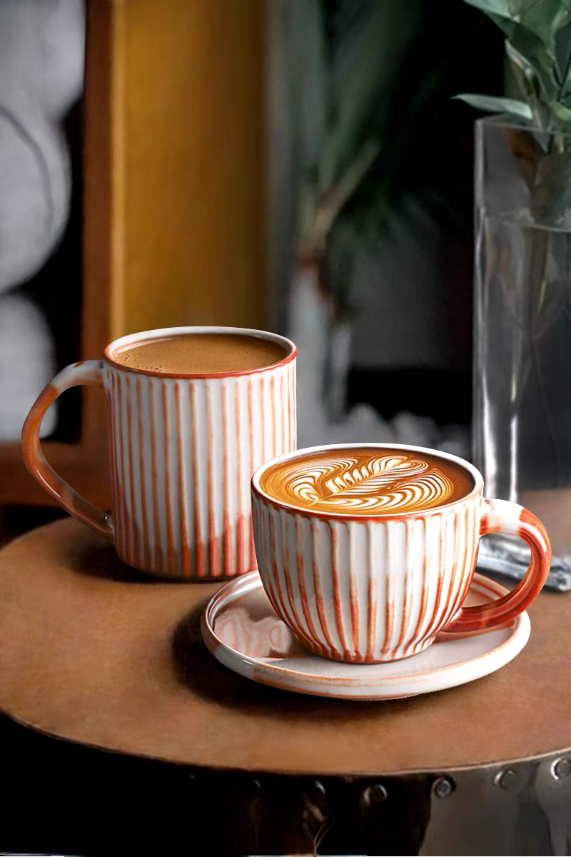 Style 4 handcrafted ridged ceramic mug in off-white and orange shown in single product view with vertical texture design