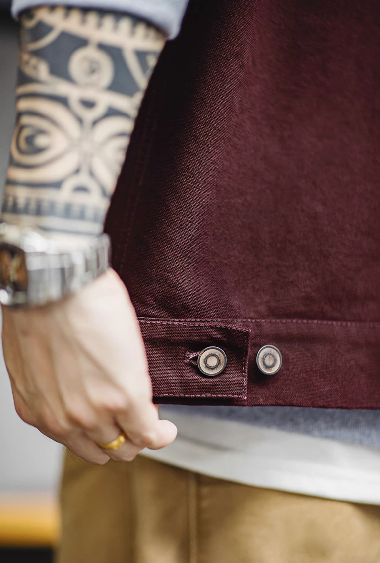 Close-up of the burgundy Hardman Detroit 90s Workwear Jacket, highlighting the buttons and pocket details.