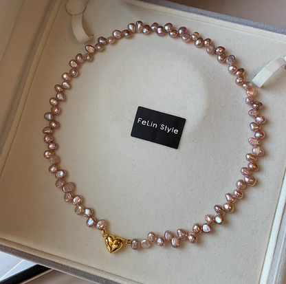Single strand champagne pink baroque pearl choker with irregular pearls and 24K gold-plated heart clasp on display box