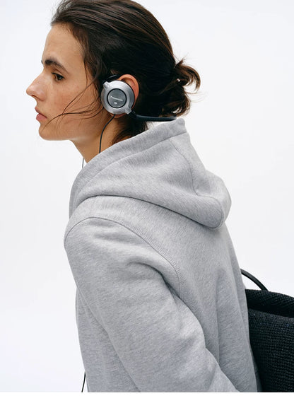 Side profile of Heather Gray zip hoodie showing hood and French terry texture