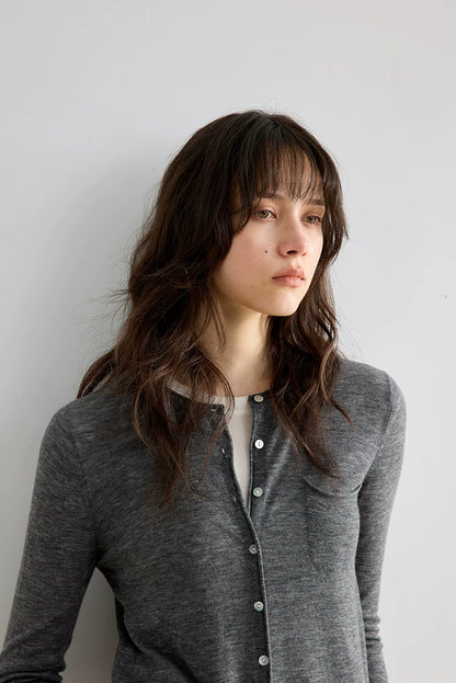 Heather Grey wool cardigan, close-up portrait showing neckline and pocket detail