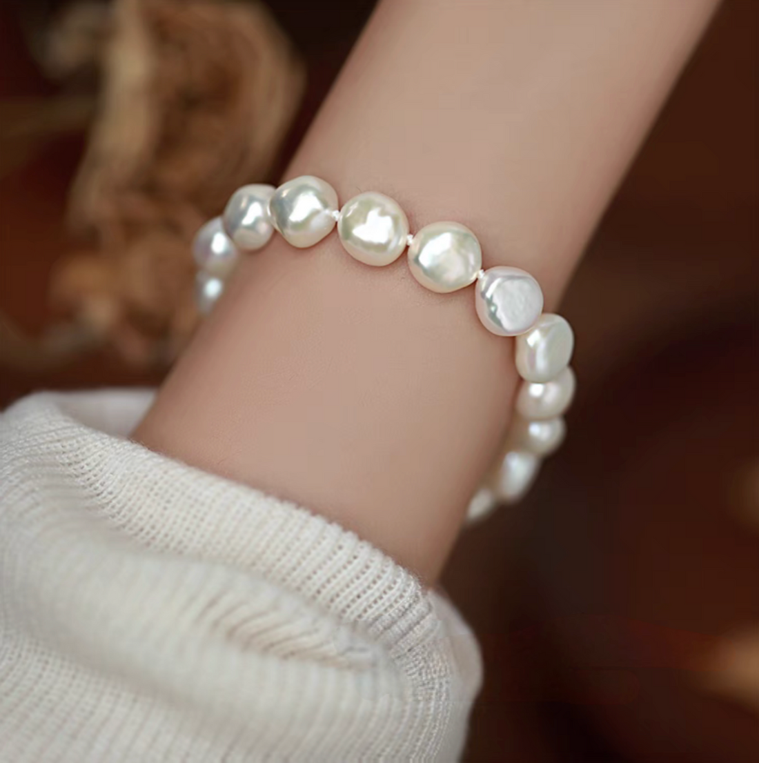 Heavy baroque freshwater pearl bracelet worn on wrist showcasing large irregular pearls with natural luster