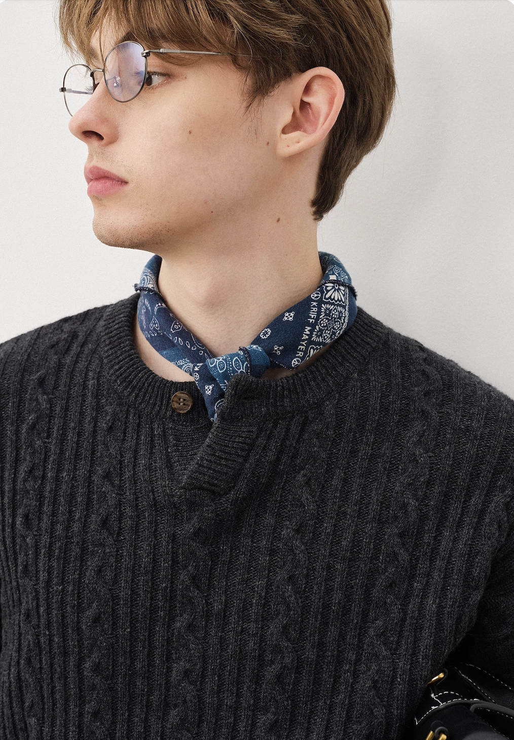 Smart casual styling with charcoal Henley wool sweater and beige pants