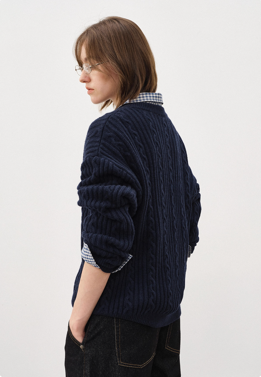 Back view of women’s navy cable-knit Henley sweater with button detail, soft wool blend, perfect for fall winter layering