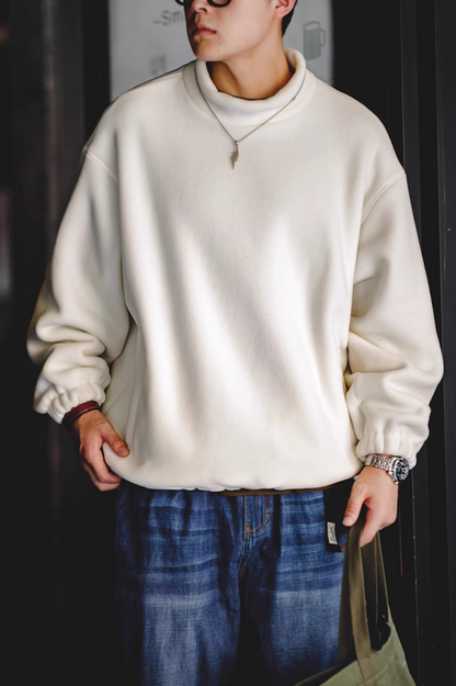 Model wearing Cream White Fleece Sweatshirt front view indoor