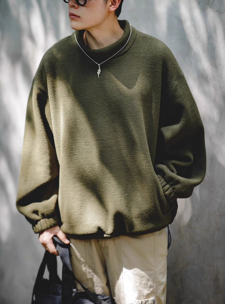 Model wearing Olive Green Fleece Sweatshirt outdoors in sunlight