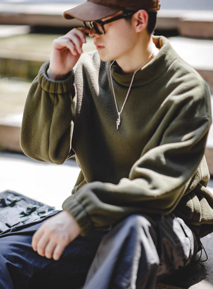Olive Green Mock Neck Sweatshirt street-style look, model seated casually