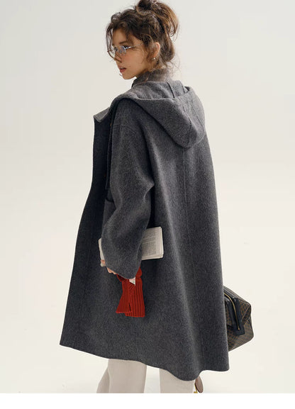 Back view of Highland Wool Toggle Coat in dark gray showcasing hooded design, clean back panel, and relaxed loose silhouette