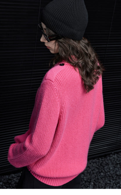 Back view of Hot Pink rib knit cardigan showing buttoned shoulder tab detail