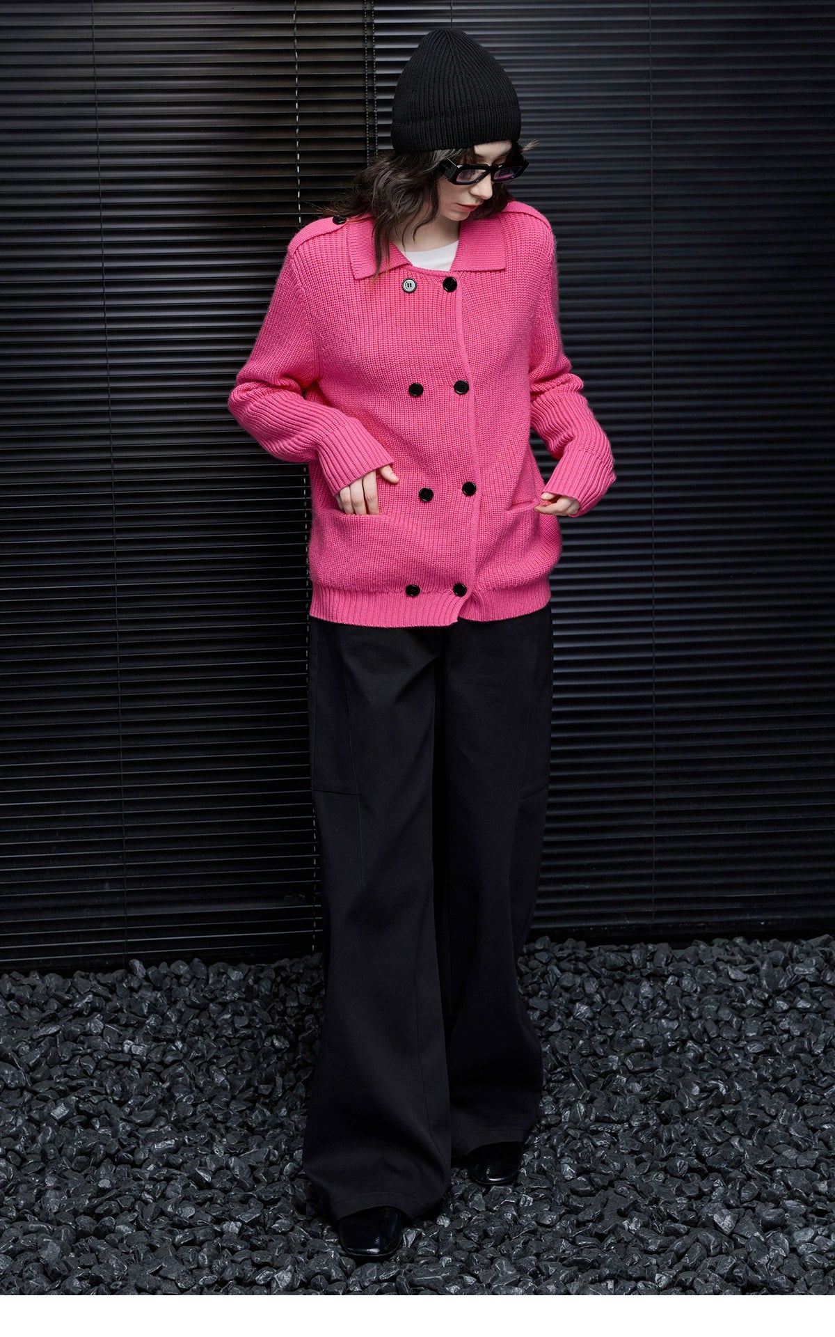 Full-length view of Hot Pink knit cardigan showing patch pockets, black buttons and ribbed hem