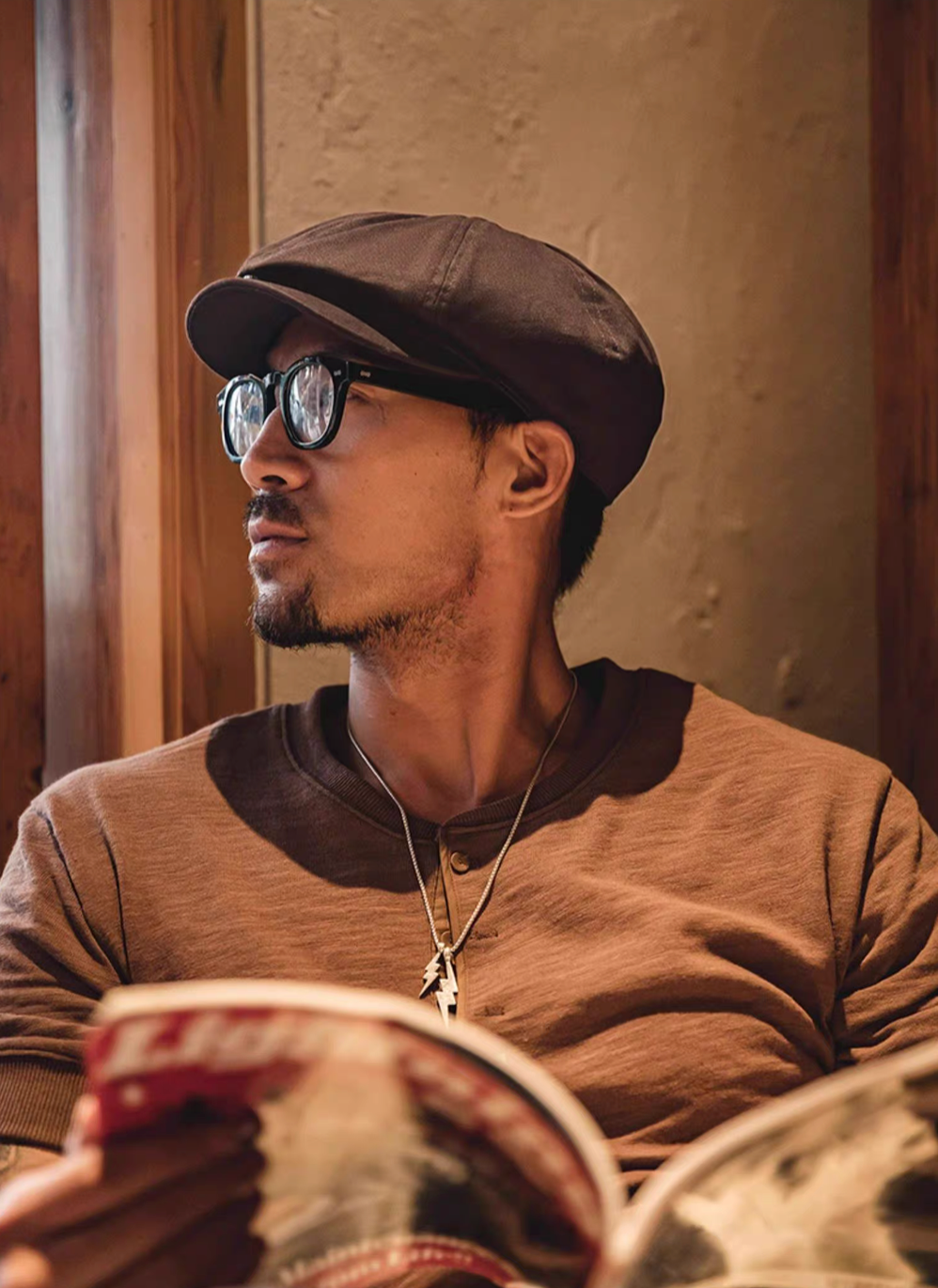 Hudson Cotton Blend Newsboy Cap coffee red worn indoors near window showing refined vintage look breathable cotton fabric and comfortable soft lining